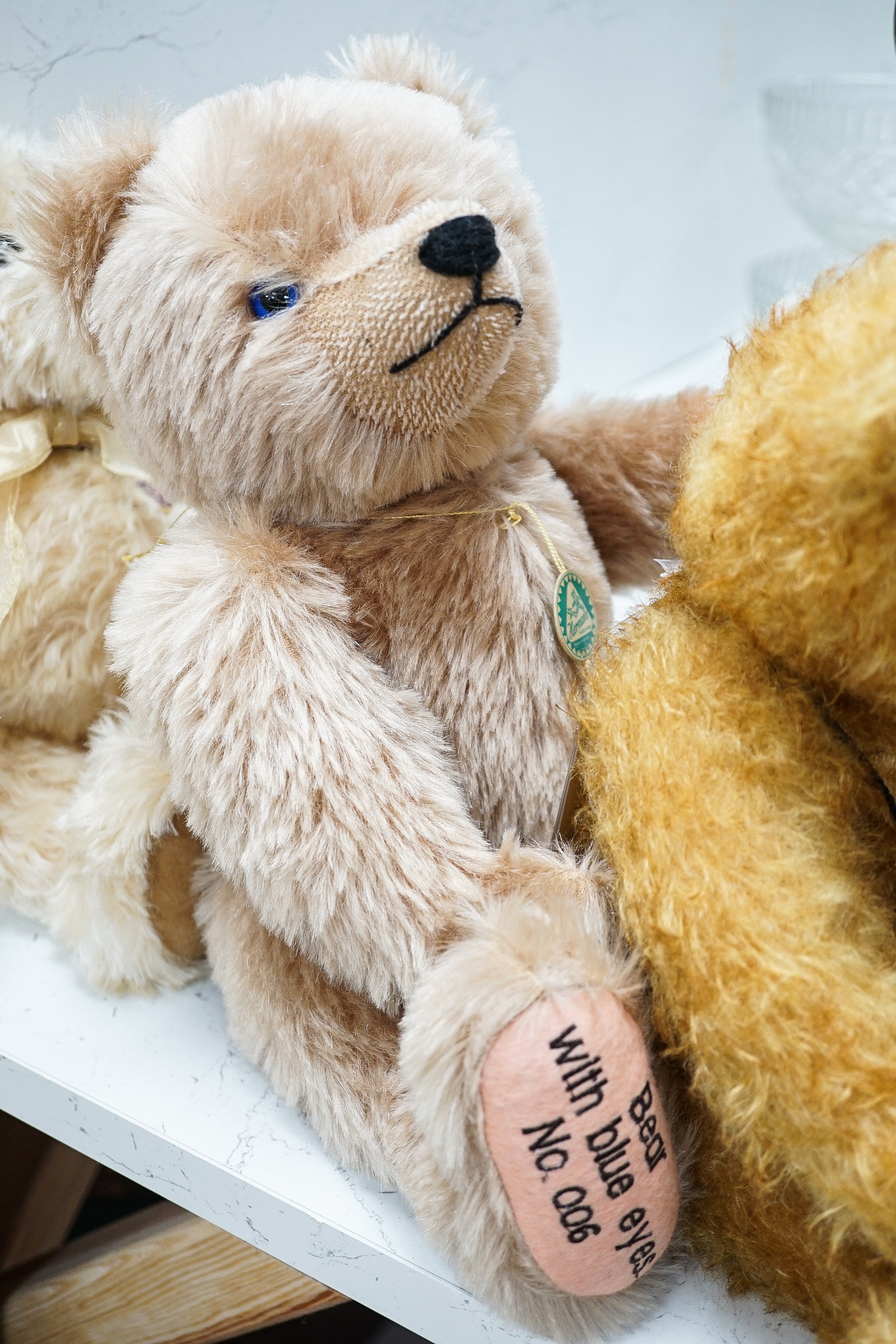 Four Deans teddy bears, a Steiff teddy and a Hermann teddy, Steiff bear, 39 cms high.